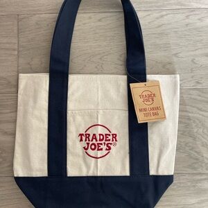 3 Trader Joe's Canvas Tote Bags - Cream & Navy, Cream & Yellow, Cream & Red.